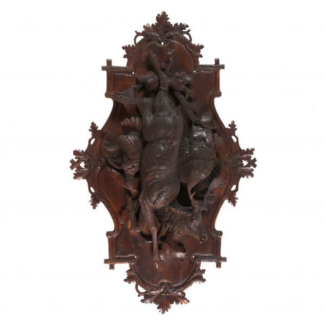 A LARGE BLACK FOREST CARVED WOOD