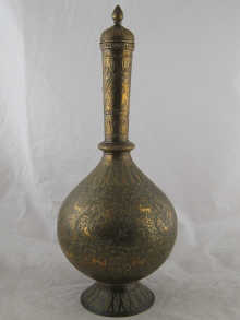 A large brass onion shaped waterpot