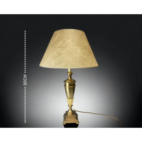 A LARGE BRUSHED BRASS TABLE