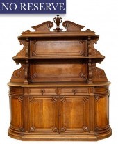 A LARGE CARVED AND STAINED WOO
