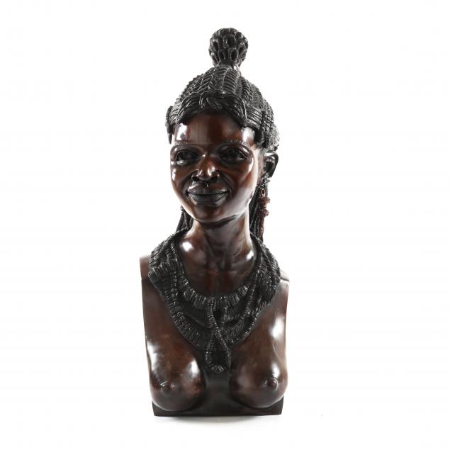 A LARGE CARVED BUST OF AFRICAN