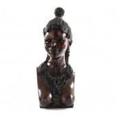 A LARGE CARVED BUST OF AFRICAN