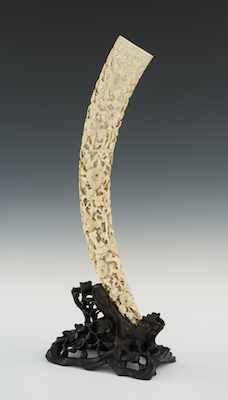 A Large Carved Ivory Tusk on