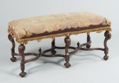 A Large Carved Wood Bench with