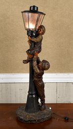A large chalk-ware table lamp, with