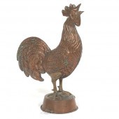 A LARGE COPPER AND BRASS WEATH
