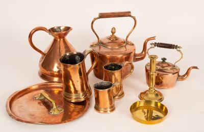 A large copper kettle with brass