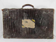 A large crocodile leather case with