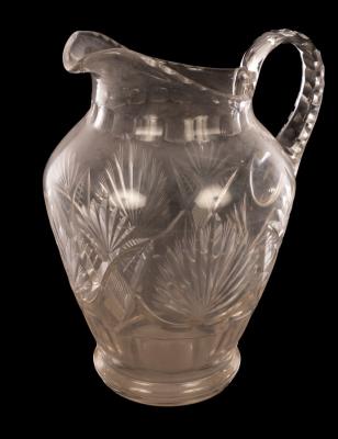 A large cut glass jug, fan