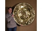 A large embossed vintage brass