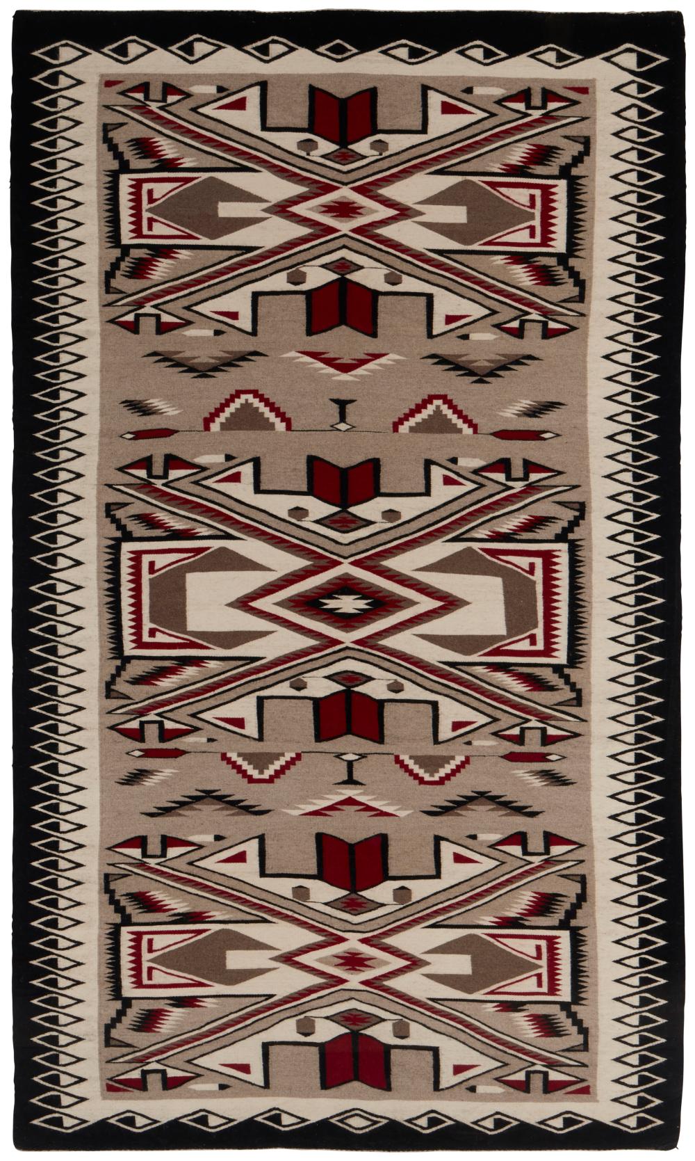 A LARGE FRAMED NAVAJO TEEC NOS