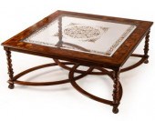 A large glass top coffee table