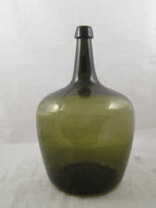 A large green glass demijohn