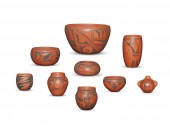 A LARGE GROUP OF BLACK-ON-RED