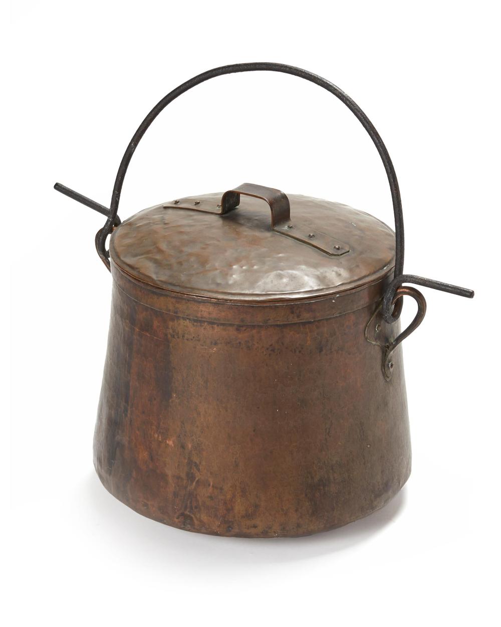 A LARGE HAMMERED COPPER AND IRON