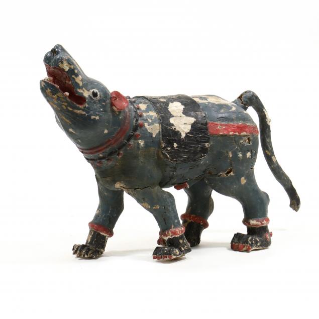 A LARGE INDIAN WOOD CARVED