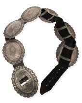 A LARGE NAVAJO SILVER CONCHO B
