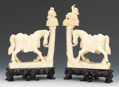A Large Pair of Carved Ivory Horses