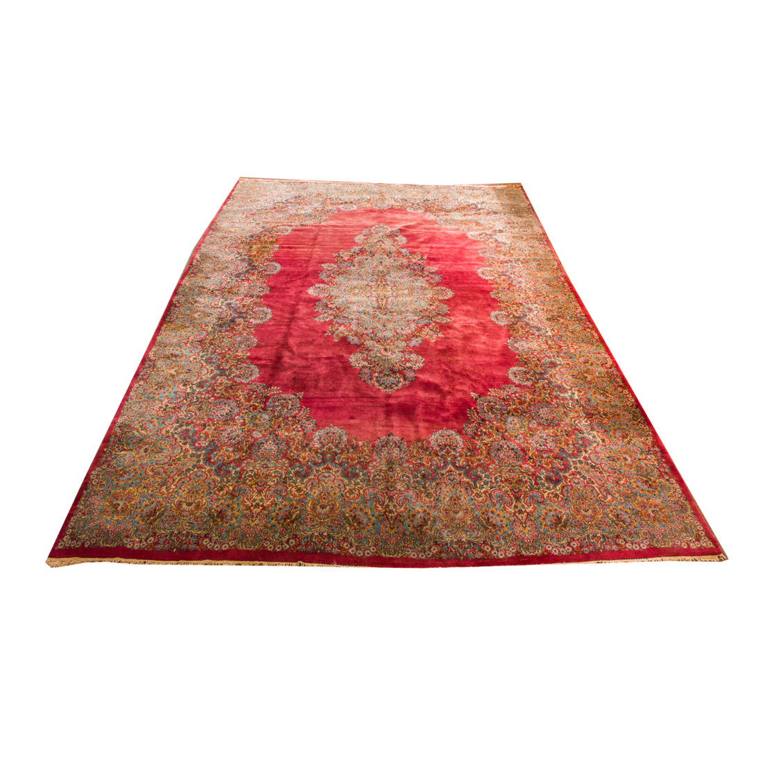 A LARGE PERSIAN KERMAN CARPET. A