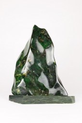 A LARGE POLISHED HARDSTONE SPE