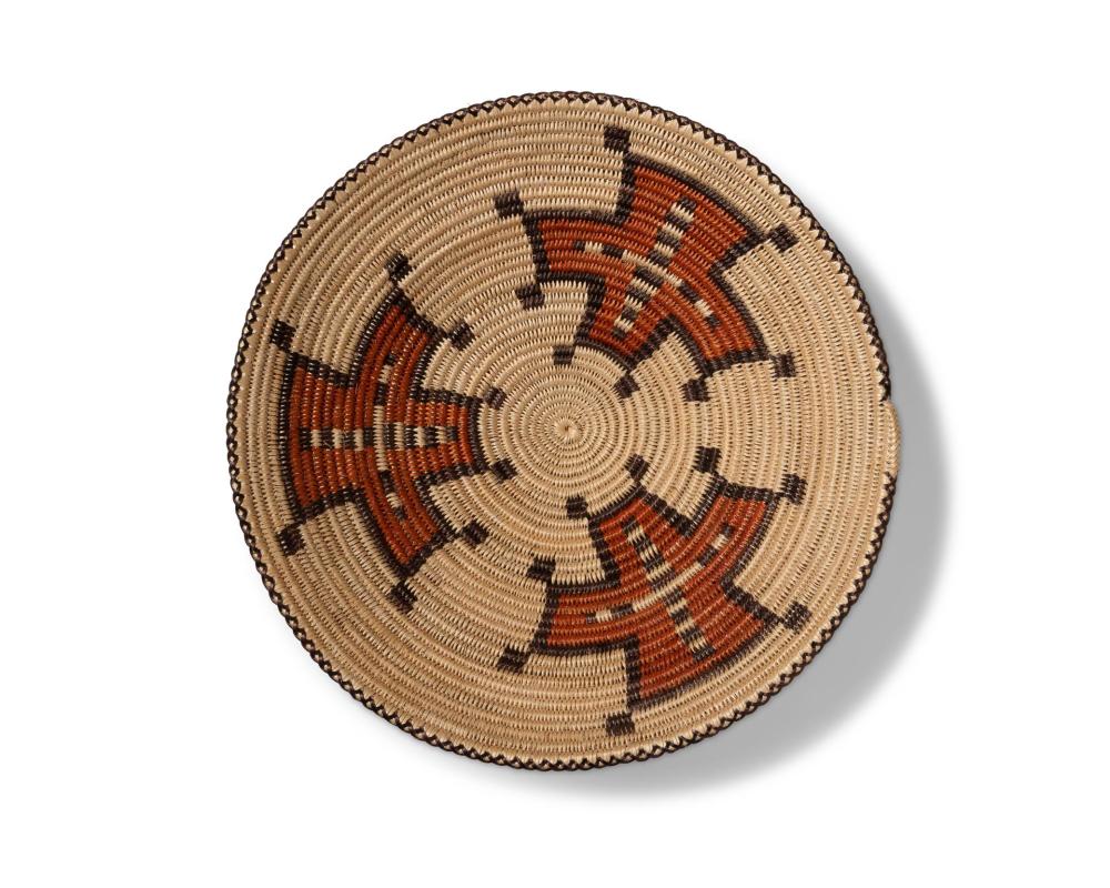 A LARGE POLYCHROME NAVAJO BASKETA