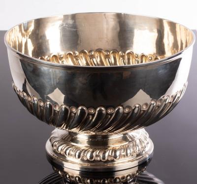 A large silver punch bowl,