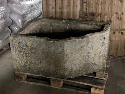 A large stone trough, approximately