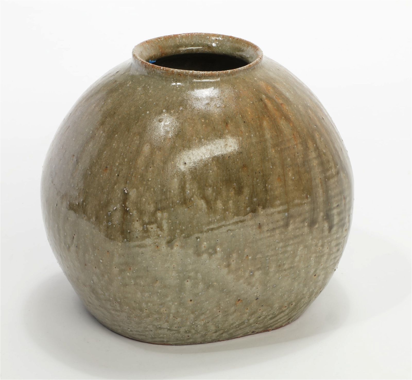 A LARGE TAN GLAZED CERAMIC