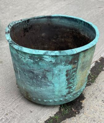 A large verdigris copper planter,