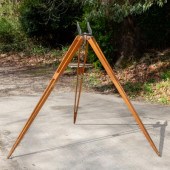 A large wooden tripod for a Br