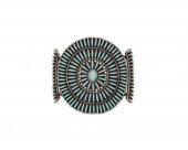A LARGE ZUNI STYLE NEEDLEPOINT
