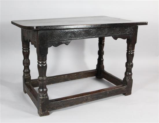 A late 17th century carved oak side