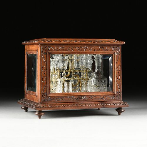 A LATE VICTORIAN CARVED WALNUT