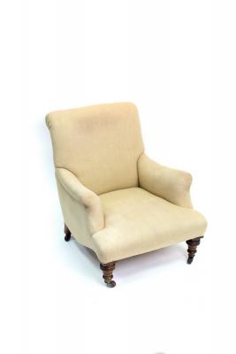A late Victorian low armchair on
