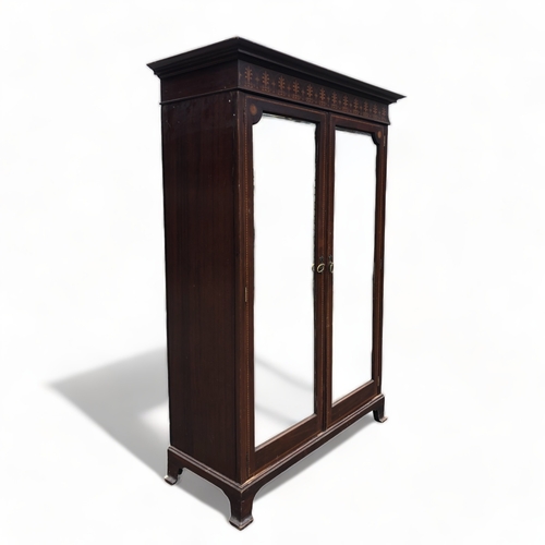 A LATE VICTORIAN MAHOGANY TWIN-DOOR