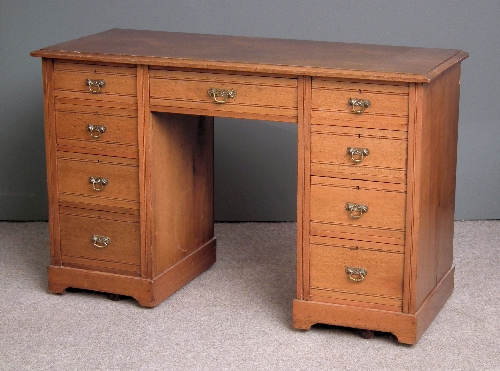 A late Victorian walnut kneehole