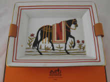 A leather mounted ceramic dish by