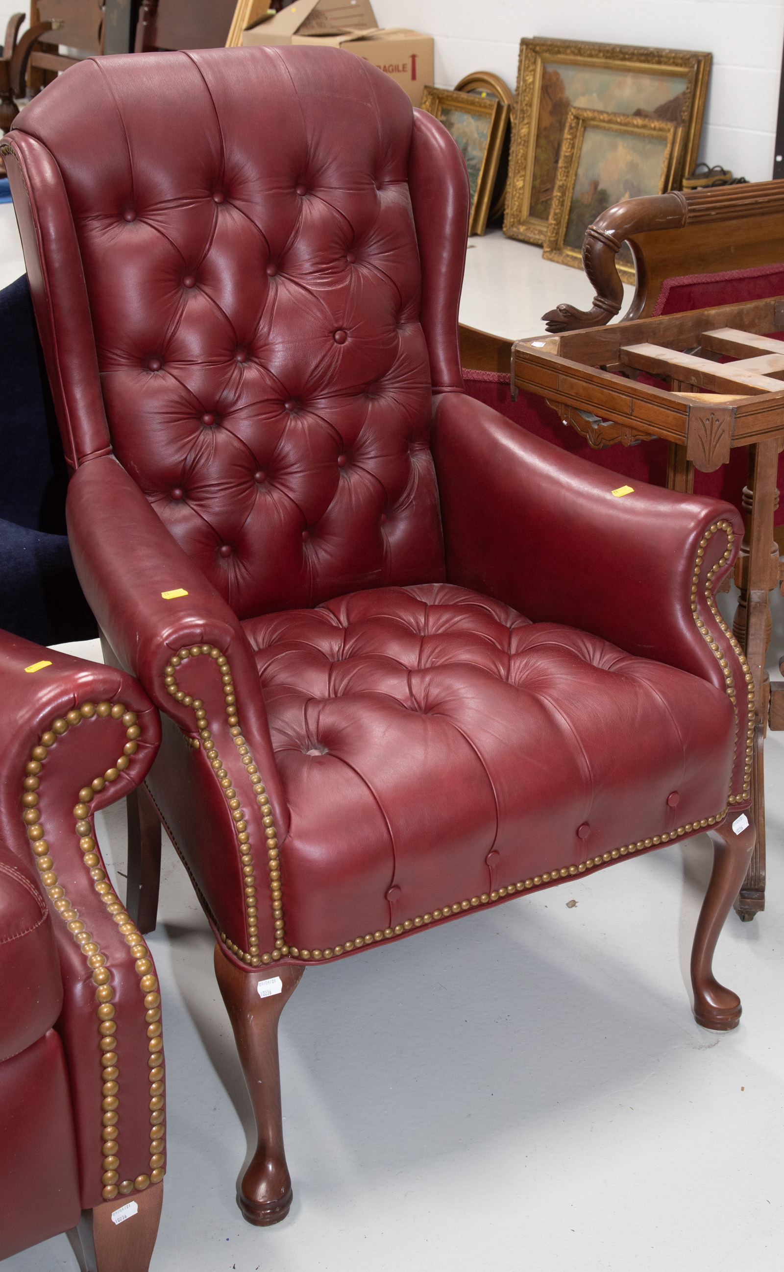 A LEATHER QUEEN ANNE STYLE WING
