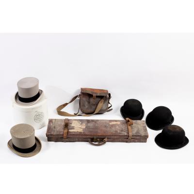 A leather shotgun case, label for