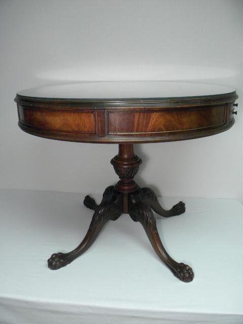 A leather top drub table on four