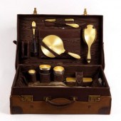 A leather travelling case by F
