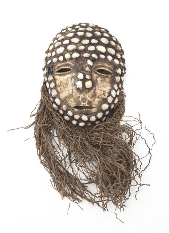 A Lega Tortoise Shell Mask.