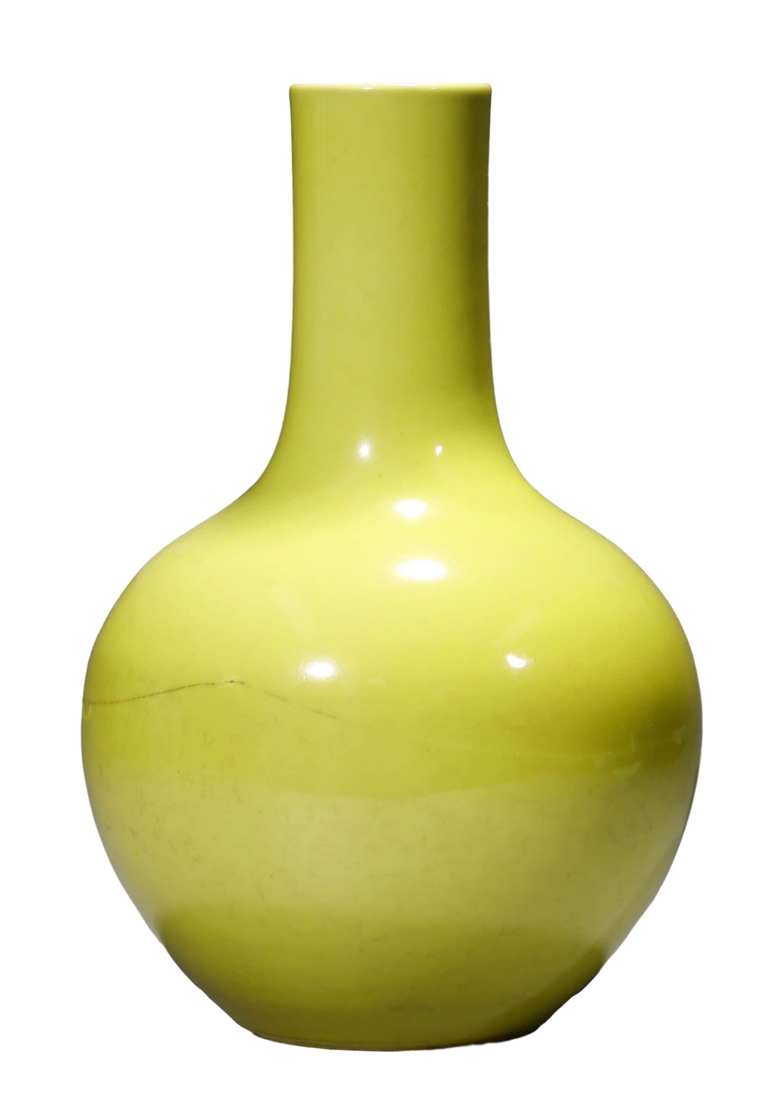 A LEMON YELLOW GLAZED GLOBULAR