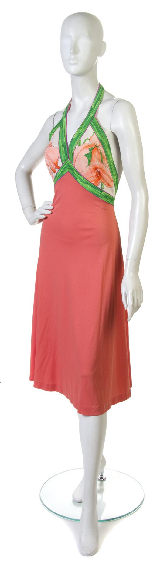 A Leonard Coral Halter Dress with a