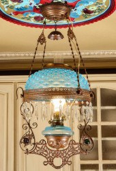 A LIBRARY LAMP WITH BLUE HOBNA