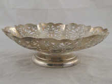 A lobed pierced silver cake dish