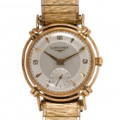 A LONGINES 14K GOLD WATCH A Lo