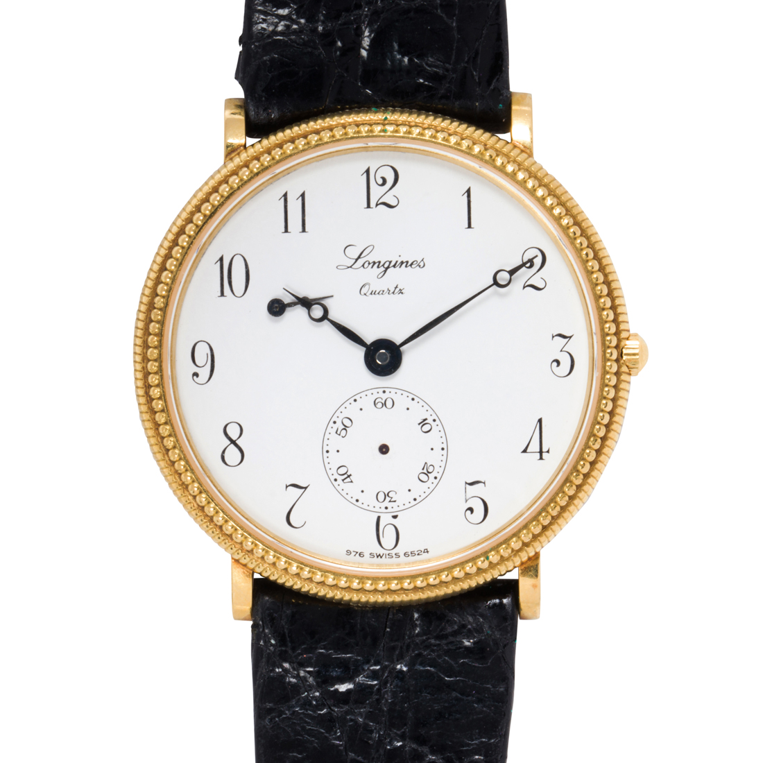 A LONGINES 18K GOLD WATCH A