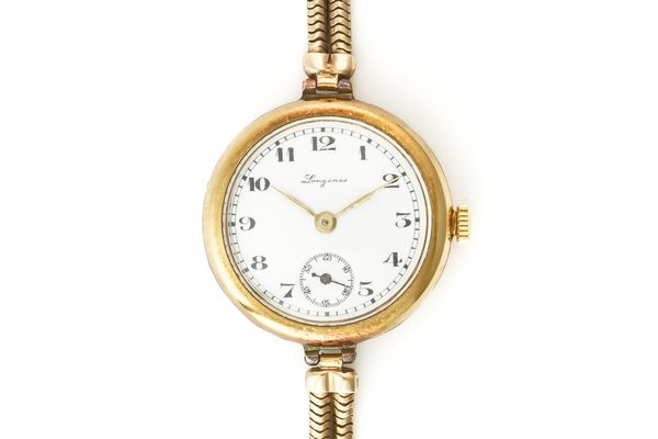 A LONGINES LADY'S GOLD BRACELET