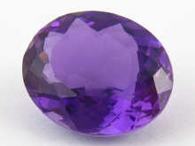 A loose polished amethyst approx.